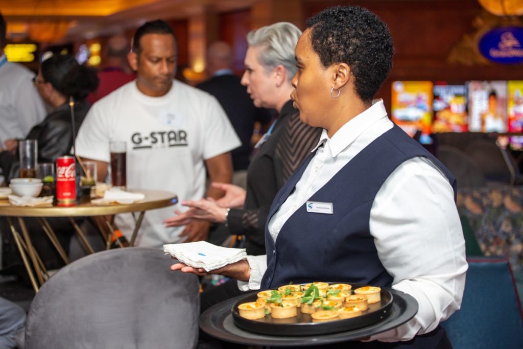 Female waiter with a platter in her hand