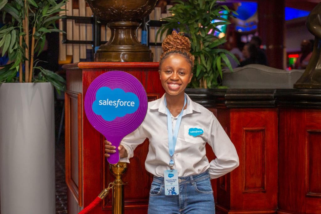 Lady Holding up a Sales Force Banner.